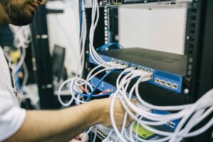 man fixing computer